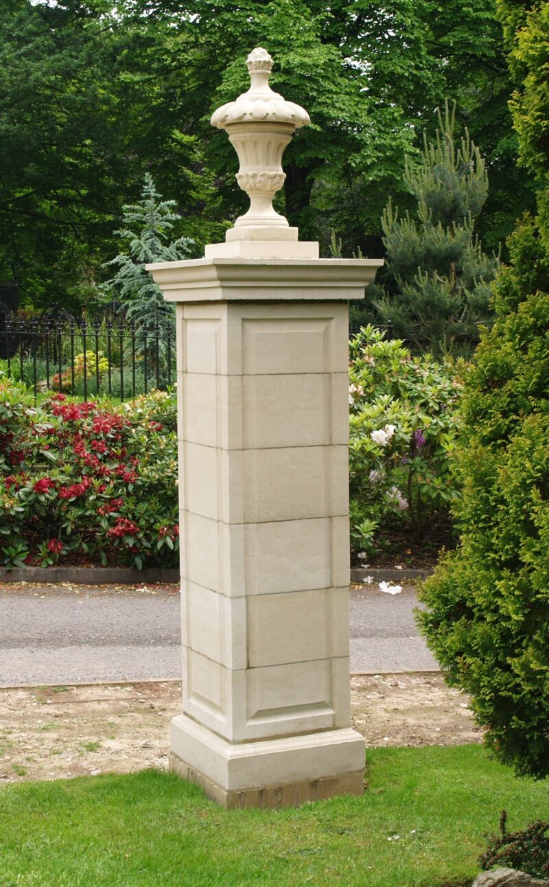 Large cast stone gate post with finial