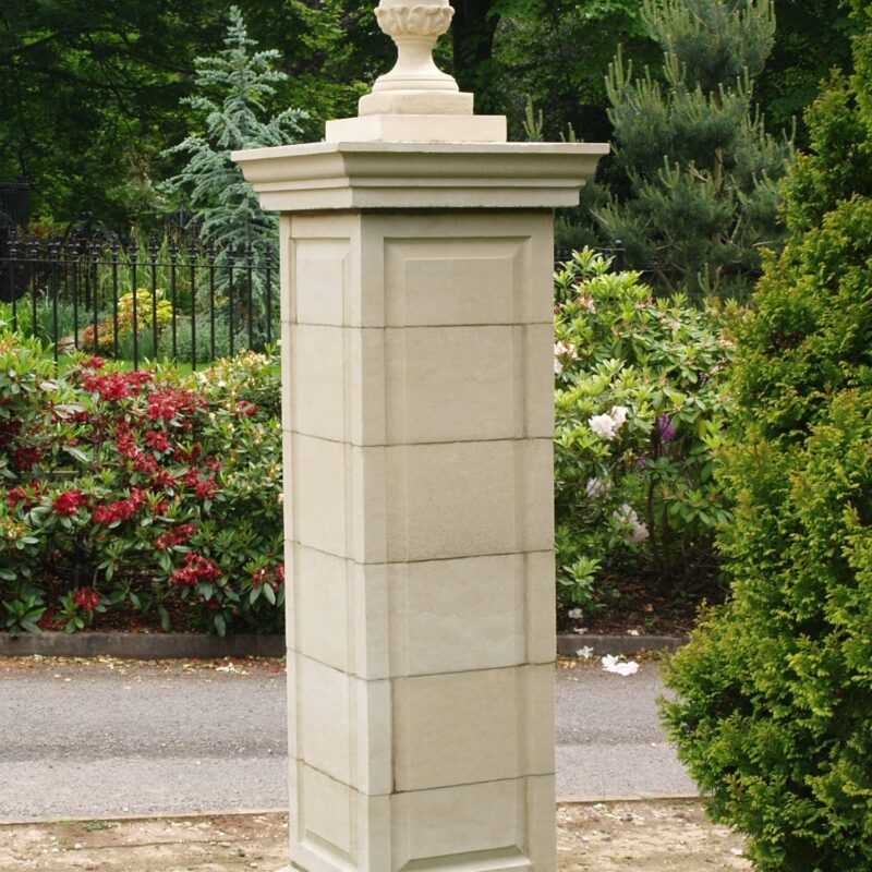 Large cast stone gate post with finial